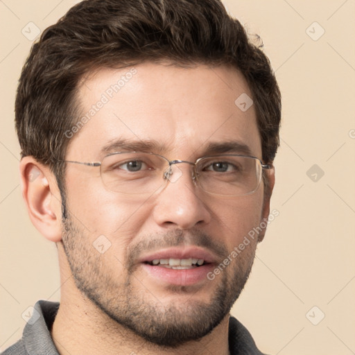 Joyful white adult male with short  brown hair and grey eyes