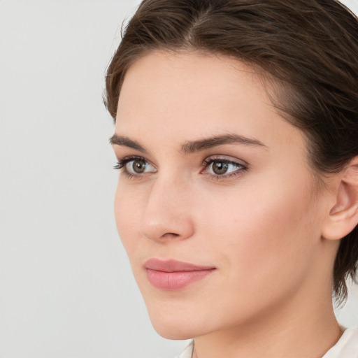 Neutral white young-adult female with medium  brown hair and brown eyes