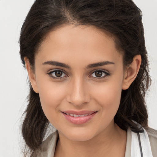 Joyful white young-adult female with medium  brown hair and brown eyes