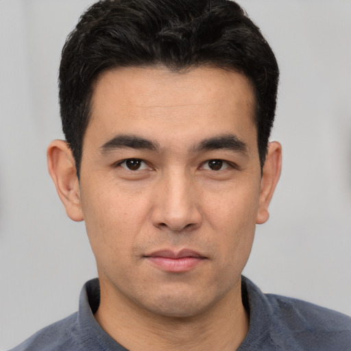 Neutral white young-adult male with short  black hair and brown eyes