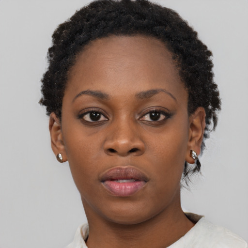 Neutral black young-adult female with short  black hair and brown eyes