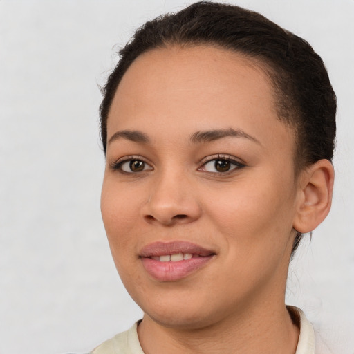 Joyful latino young-adult female with short  brown hair and brown eyes