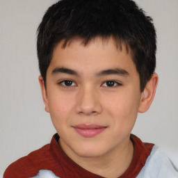 Joyful white child male with short  brown hair and brown eyes