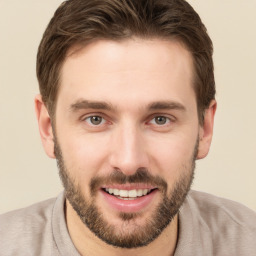 Joyful white young-adult male with short  brown hair and brown eyes