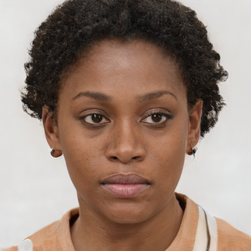 Neutral black young-adult female with short  brown hair and brown eyes