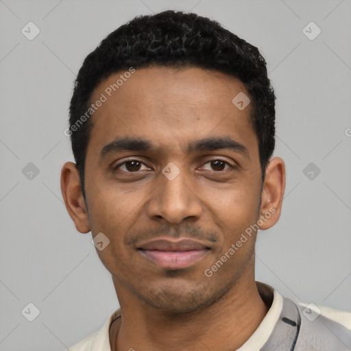 Joyful black young-adult male with short  black hair and brown eyes