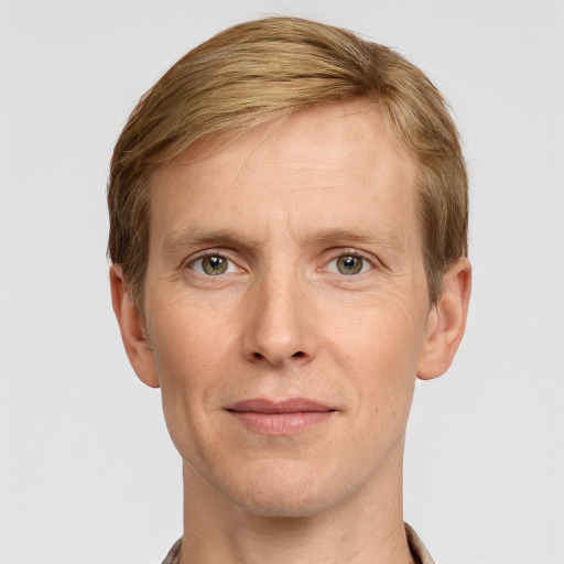 Joyful white adult male with short  brown hair and grey eyes