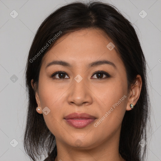 Joyful asian young-adult female with long  brown hair and brown eyes