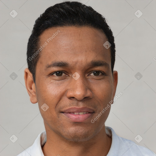 Joyful latino young-adult male with short  black hair and brown eyes