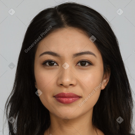 Joyful latino young-adult female with long  brown hair and brown eyes