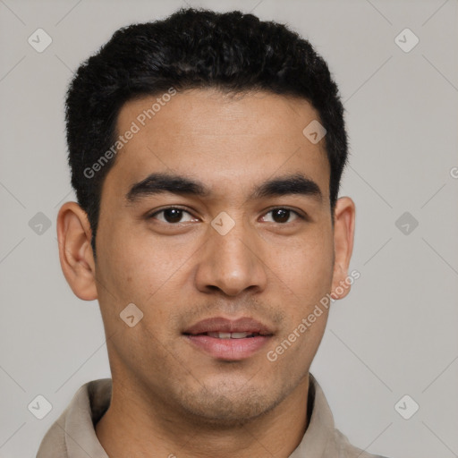 Joyful latino young-adult male with short  black hair and brown eyes