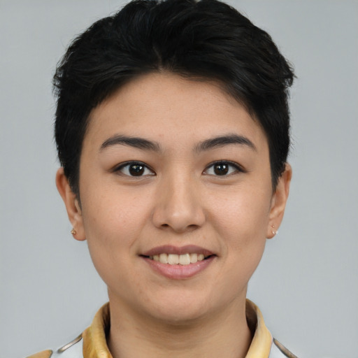Joyful asian young-adult female with short  brown hair and brown eyes