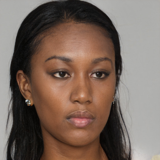 Neutral black young-adult female with long  brown hair and brown eyes