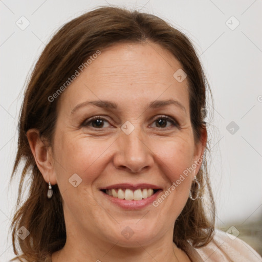 Joyful white adult female with medium  brown hair and grey eyes