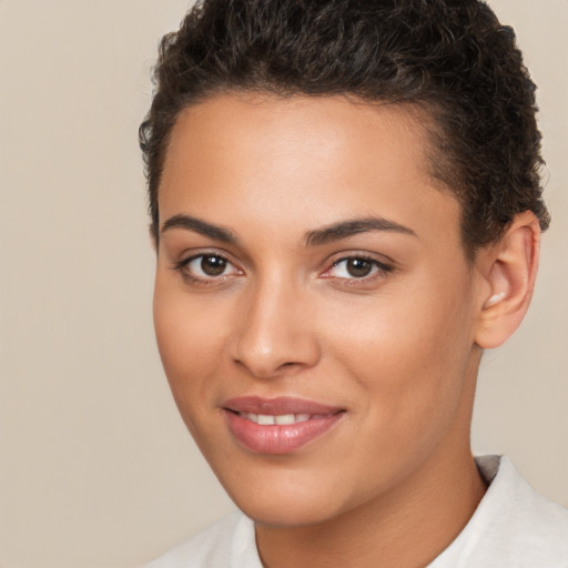 Joyful white young-adult female with short  brown hair and brown eyes