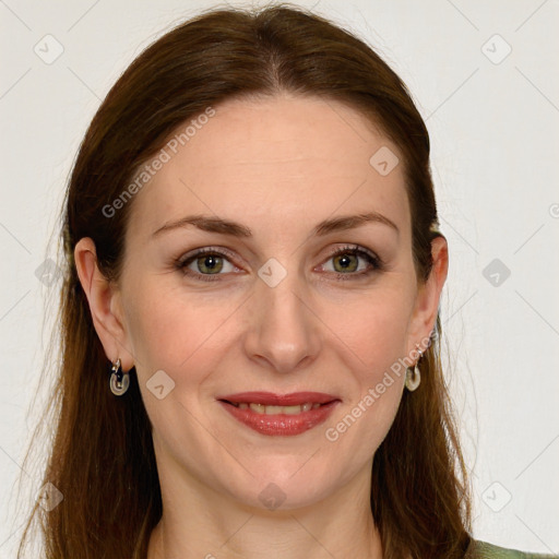 Joyful white young-adult female with long  brown hair and green eyes