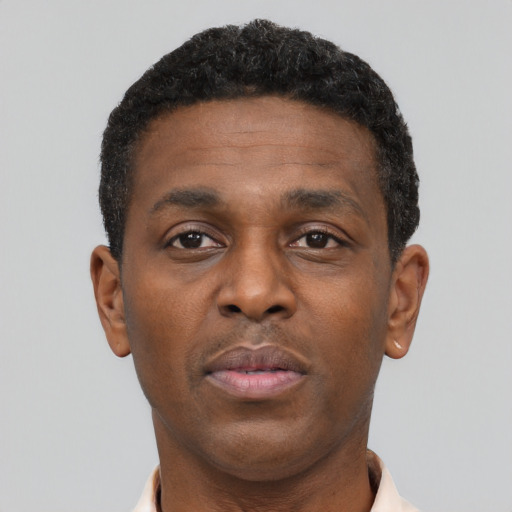 Neutral black young-adult male with short  brown hair and brown eyes