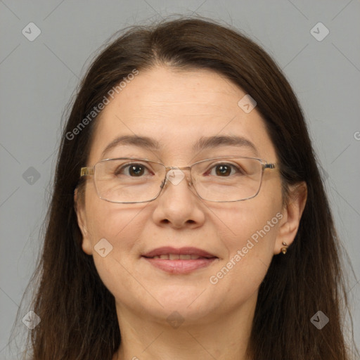 Joyful white adult female with long  brown hair and brown eyes