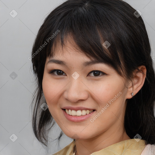 Joyful asian young-adult female with medium  brown hair and brown eyes