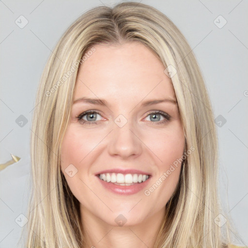 Joyful white young-adult female with long  brown hair and blue eyes