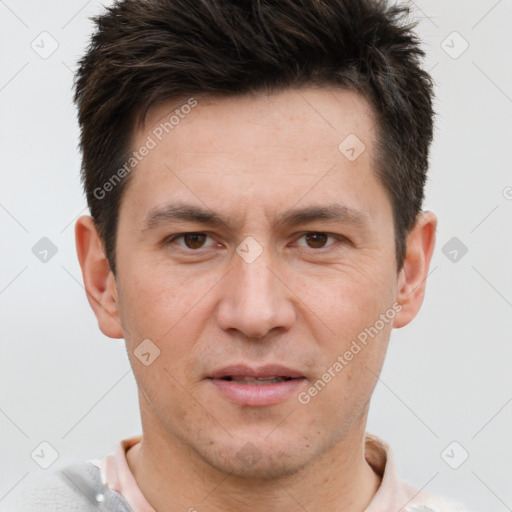 Joyful white adult male with short  brown hair and brown eyes