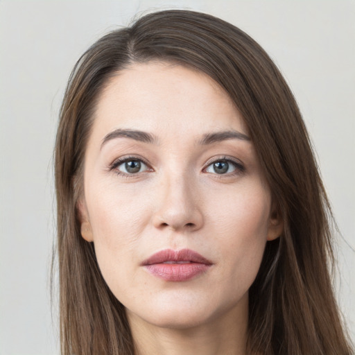 Neutral white young-adult female with long  brown hair and grey eyes