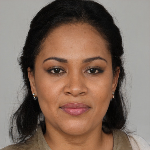 Joyful black young-adult female with medium  black hair and brown eyes