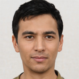 Joyful asian young-adult male with short  black hair and brown eyes