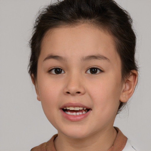 Joyful white child female with medium  brown hair and brown eyes