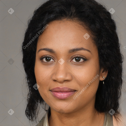 Joyful black young-adult female with long  black hair and brown eyes