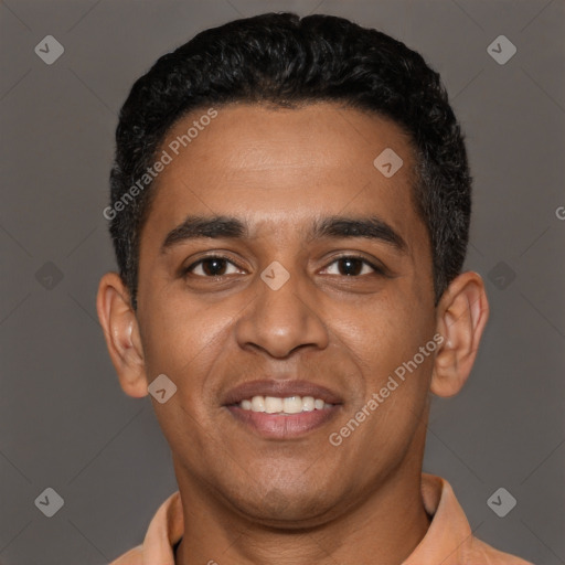 Joyful latino young-adult male with short  black hair and brown eyes