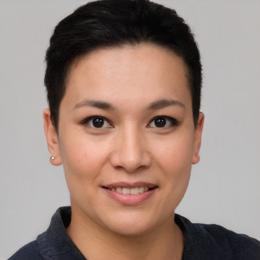 Joyful white young-adult female with short  brown hair and brown eyes