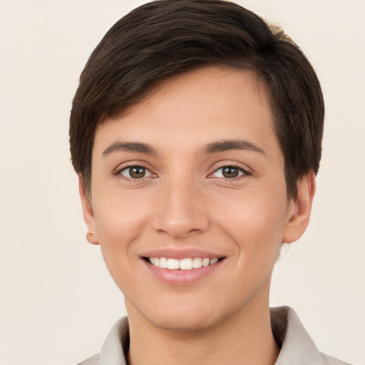 Joyful white young-adult female with short  brown hair and brown eyes