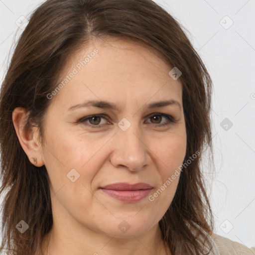 Joyful white adult female with long  brown hair and brown eyes