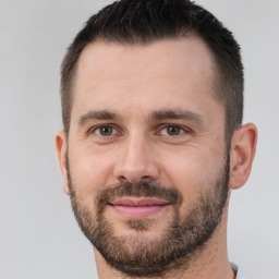 Joyful white adult male with short  brown hair and brown eyes