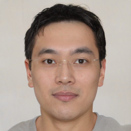 Neutral asian young-adult male with short  black hair and brown eyes