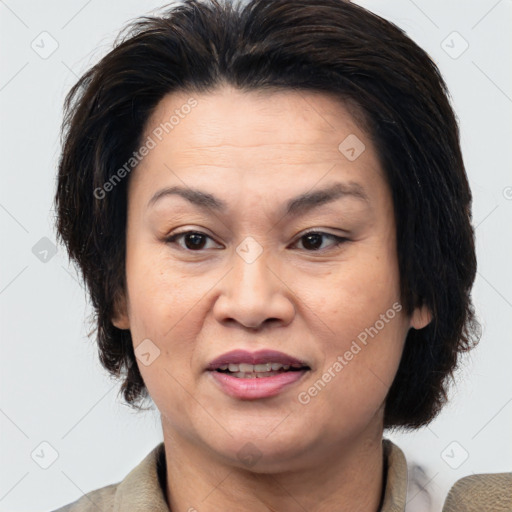 Joyful white adult female with medium  brown hair and brown eyes