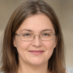 Joyful white adult female with medium  brown hair and brown eyes