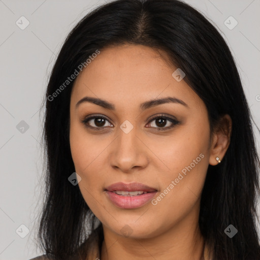 Joyful latino young-adult female with long  brown hair and brown eyes