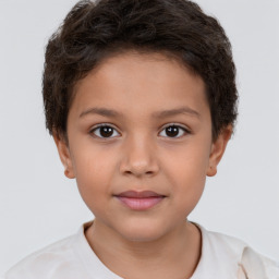 Joyful white child female with short  brown hair and brown eyes