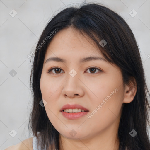 Joyful asian young-adult female with long  brown hair and brown eyes