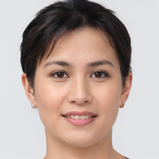 Joyful white young-adult female with short  brown hair and brown eyes