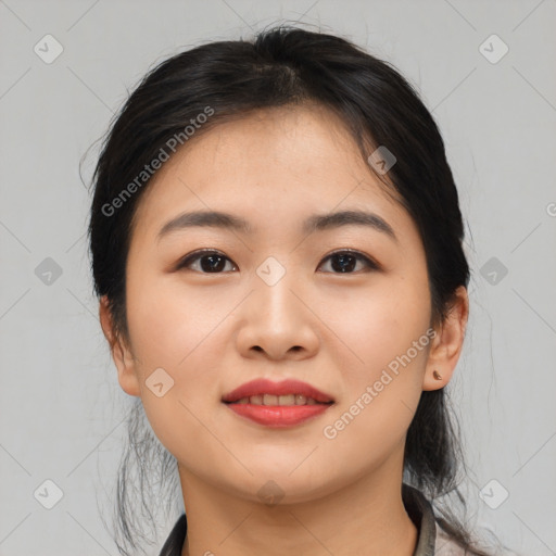 Joyful asian young-adult female with medium  black hair and brown eyes