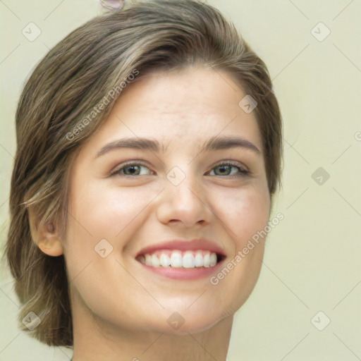 Joyful white young-adult female with medium  brown hair and green eyes