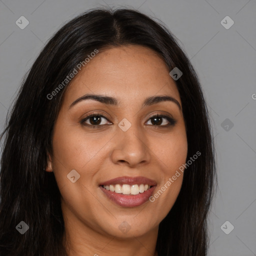 Joyful latino young-adult female with long  brown hair and brown eyes