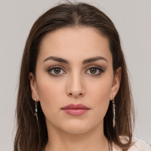 Neutral white young-adult female with long  brown hair and brown eyes