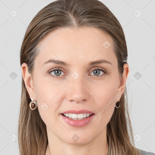 Joyful white young-adult female with long  brown hair and grey eyes