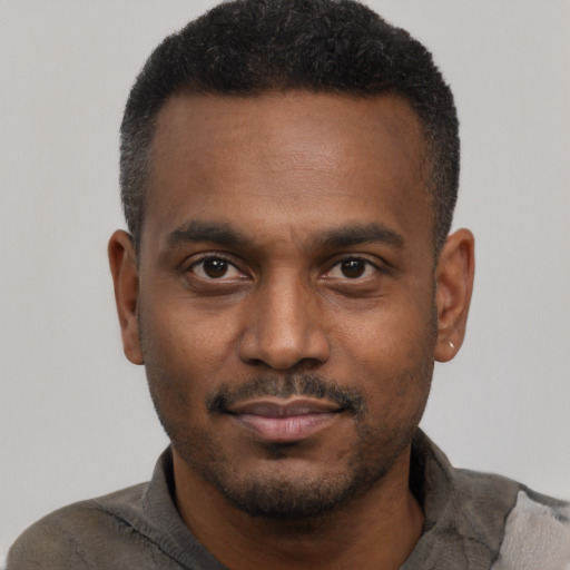 Neutral black young-adult male with short  black hair and brown eyes
