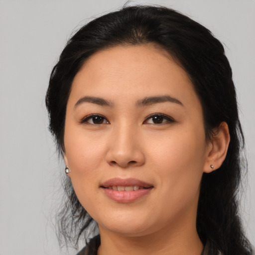 Joyful asian young-adult female with medium  black hair and brown eyes