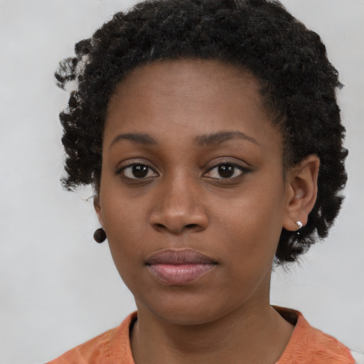 Neutral black young-adult female with short  brown hair and brown eyes